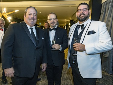 Martin Duguay, left, Stephane Caron and Olivier Foret, right, at a fundraiser cocktail for La Fondation immobilière de Montréal pour les jeunes at the Queen Elizabeth Hotel in Montreal on Friday, Oct. 21, 2022.