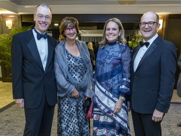 Jean-Charles Angers and his wife, Tina Serafin, left, and Mylène Guertin with husband Armand DesRosiers at a fundraiser cocktail for La Fondation immobilière de Montréal pour les jeunes at the Queen Elizabeth Hotel in Montreal on Friday, Oct. 21, 2022.