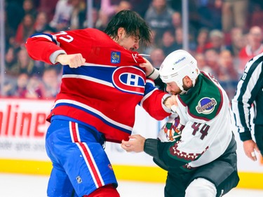 Canadiens' Arber Xhekaj punches Arizona Coyotes Zack Kassian during first period of National Hockey League game in Montreal Thursday Oct. 20, 2022.