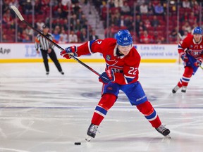 Montreal Canadiens winger Cole Caufield loads up for a slap shot during first period against the Arizona Coyotes in Montreal on Oct. 20, 2022.