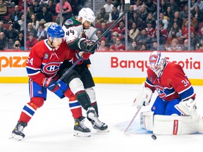 Montreal Canadiens defenceman Jordan Harris ties up Arizona Coyotes Zack Kassian as Habs goalie Jake Allen makes a save during second period in Montreal on Oct. 20, 2022.