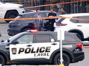 Laval police investigate the scene where Vincenzo Armeni, a convicted cocaine trafficker, was killed on Tuesday, October 25, 2022.