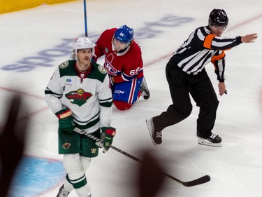 A penalty shot was called against Minnesota Wild defenseman Jon Merrill (4) after he took down Montreal Canadiens left wing Mike Hoffman (68) in front of the Minnesota Wild net during 3rd period NHL action at the Bell Centre in Montreal on Tuesday Oct. 25, 2022.