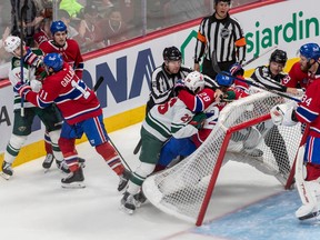 Things got a little heated behind the net of Montreal Canadiens goaltender Jake Allen (34) during 2nd period NHL action at the Bell Centre in Montreal on Tuesday Oct. 25, 2022.