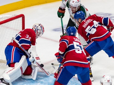 Montreal Canadiens goaltender Jake Allen (34) blocks a shot from Minnesota Wild left wing Matt Boldy (12) with his goal stick during 2nd period NHL action at the Bell Centre in Montreal on Tuesday Oct. 25, 2022.