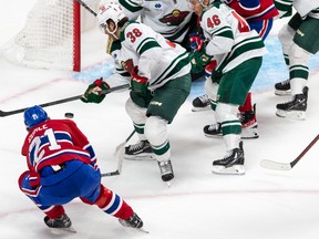 Montreal Canadiens defenceman Kaiden Guhle (21) can't score on the short side against Minnesota Wild goaltender Marc-André Fleury (29) during 3rd period NHL action at the Bell Centre in Montreal on Tuesday Oct. 25, 2022.