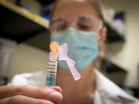 Nurse Jessica Mann Bourgouin prepares to administer a flu shot in 2020.