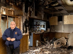 John Floud stands inside the Royal Canadian Legion branch in Roxboro after it was damaged by a fire.