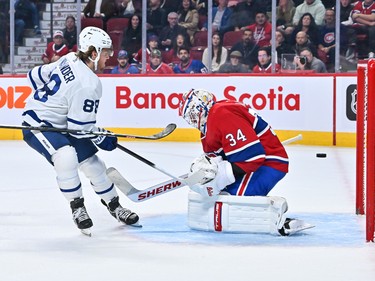 William Nylander #88 of the Toronto Maple Leafs scores on goaltender Jake Allen #34 of the Montreal Canadiens during the third period at Centre Bell on October 12, 2022 in Montreal.