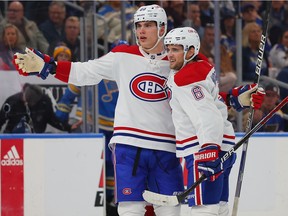 Montreal Canadiens' Juraj Slafkovsky, left, celebrates after scoring a goal against the St. Louis Blues with Chris Wideman during the second period at the Enterprise Center in St Louis on Oct. 29, 2022.