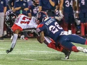 Montreal Alouettes linebacker Tyrice Beverette tackles Ottawa Redblacks wide-receiver DeVonte Dedmon at Percival Molson Stadium in Montreal on Sept. 2, 2022.