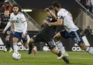 CF Montreal's Joaquin Torres squeezes between Martin Rodriguez and DC United's Steve Birnbaum with the ball during second half MLS action in Montreal on Saturday, October 1, 2022.  