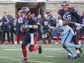 Alouettes quarterback Trevor Harris (7) runs for yards during first half CFL football action against the Toronto Argonauts in Montreal on Saturday, Oct. 22, 2022.