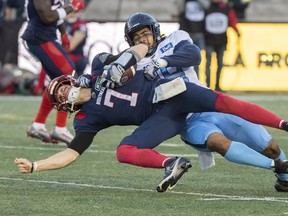 Alouettes quarterback Trevor Harris (7) is sacked by Toronto Argonauts’ Ali Fayad  during second half CFL football action in Montreal on Saturday, October 22, 2022