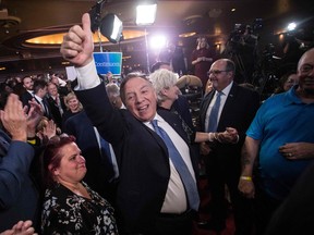 François Legault celebrates Coalition Avenir Québec's re-election Monday night in Quebec City. "This past week, I've been struggling to overcome an inclination to just tune out," Fariha Naqvi-Mohamed writes.