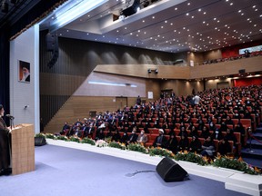 A handout picture provided by the Iranian presidency on Oct. 8, 2022, shows Iran's President, Ebrahim Raisi, speaking to female students during a ceremony marking the beginning of the academic year, in the capital Tehran's Al-Zahra university.