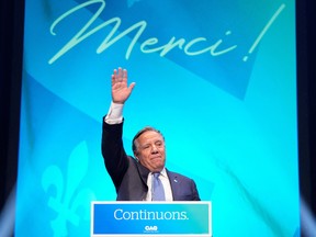 Premier François Legault waves at an election night rally in Quebec City, October 3, 2022.