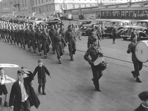 Soldiers from the 5th Field Battery R.C.A. parade near Champ de Mars on Oct. 28, 1945 after their return home from Europe.