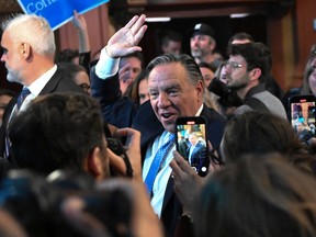 Coalition Avenir Quebec Leader François Legault waves as he walks in for his victory speech, Monday, October 3, 2022 in Quebec City.