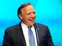 Premier François Legault makes his victory speech to supporters at the Coalition Avenir Québec election night headquarters, in Quebec City, Monday, Oct. 3, 2022.