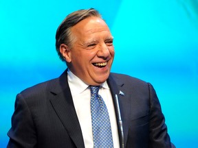 Premier François Legault makes his victory speech to supporters at the Coalition Avenir Québec election night headquarters, in Quebec City, Monday, Oct. 3, 2022.