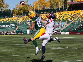 Alouettes' Mike Jones (8) and  Edmonton Elks Vincent Forbes-Mombleau (82) via for the ball in Edmonton on Saturday, Oct. 1, 2022.