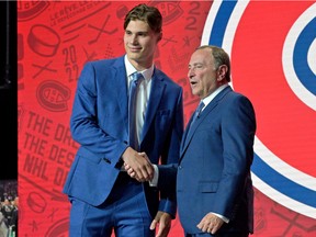Juraj Slafkovsky shakes hands with NHL commissioner Gary Bettman after the Canadiens made him the No. 1 overall pick at the 2022 NHL draft at the Bell Centre.