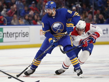 Montreal Canadiens right wing Brendan Gallagher (11) defends as Buffalo Sabres right wing Alex Tuch (89) controls the puck during the second period at KeyBank Center in Buffalo, N.Y., on Oct. 27, 2022.