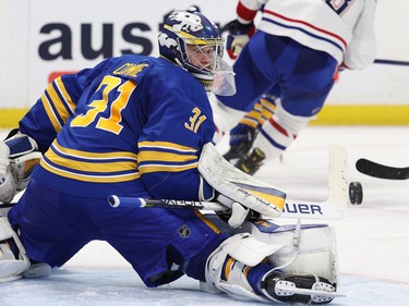 Buffalo Sabres goaltender Eric Comrie (31) makes a save during the third period against the Montreal Canadiens at KeyBank Center in Buffalo, N.Y., on Oct. 27, 2022.