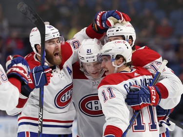Montreal Canadiens right wing Brendan Gallagher (11) celebrates his goal with teammates during the third period against the Buffalo Sabres at KeyBank Center in Buffalo, N.Y., on Oct. 27, 2022.