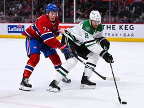 Dallas Stars defenceman Jani Hakanpaa (2) controls the puck against Canadiens' Jake Evans (71) at Bell Centre in Montreal on Saturday, Oct. 22, 2022.