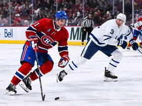Montreal Canadiens centre Sean Monahan plays the puck agaisnt the Toronto Maple Leafs during the third period at the Bell Centre on Oct. 3 in Momtreal.