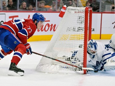 Montreal Canadiens forward Kirby Dach (77) attempts a wrap around against Toronto Maple Leafs goalie Matt Murray (30) during the second period at the Bell Centre on Oct. 12, 2022. A lengthy review concluded there was no goal on the play.