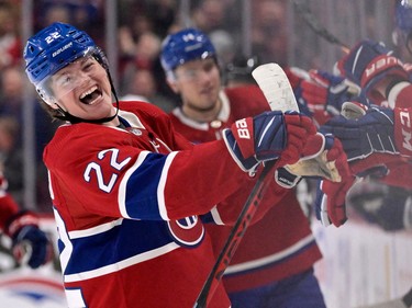 Canadiens forward Cole Caufield (22) celebrates a goal scored by teammate forward Josh Anderson (not pictured) against the Toronto Maple Leafs during the third period at the Bell Centre on Oct. 12, 2022.