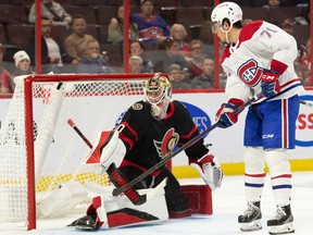 Canadiens' Jake Evans scores against Senators goalie Mads Sogaard  at the Canadian Tire Centre in Ottawa on Saturday, Oct. 1, 2022.