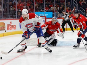 Canadiens' Josh Anderson (17) skates with the puck in front of Washington Capitals goaltender Darcy Kuemper as Capitals defenceman Dmitry Orlov (9) defends in the second period at Capital One Arena on Saturday, Oct. 15, 2022, in Washington, D.C.