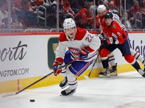 Montreal Canadiens right wing Cole Caufield (22) skates with the puck past Washington Capitals defenceman Dmitry Orlov (9) in the second period at Capital One Arena in Washington, D.C., on Saturday, October 15, 2022.