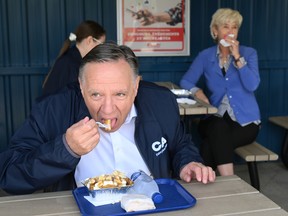 François Legault led an investigation into the true name of poutine cheese.