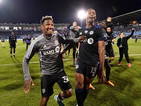 CF Montreal players including midfielder Romell Quioto (30) and forward Mason Toye (13) celebrate after defeating Orlando City SC at Saputo Stadium in Montreal.