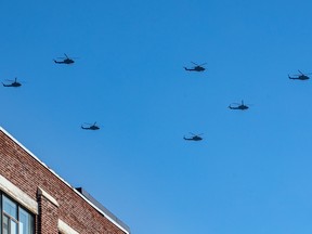Seven Canadian Armed Forces CH-146 Griffon helicopters flew over downtown Montreal Oct. 5, 2022.