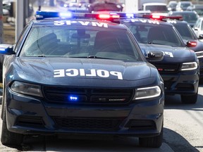 MONTREAL, QUE.: APRIL 12, 2022 --  Montreal police cars at the scene of shooting in the drive-thru entrance of car wash on Metropolitain on Tuesday April 12, 2022. (Pierre Obendrauf / MONTREAL GAZETTE) ORG XMIT: 67671 - 8055