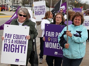 Health care workers picket in Sarnia, Ont. in 2019. Statistics released this week "revealed that, on average, in Quebec women earned 91 per cent of the hourly salary of men," Martine St-Victor writes.