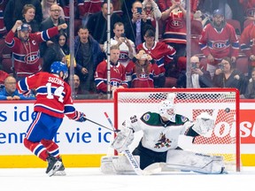 Montreal Canadiens captain Nick Suzuki scores past Arizona Coyotes' Connor Ingram on a penalty shot during second in Montreal on Oct. 20, 2022.