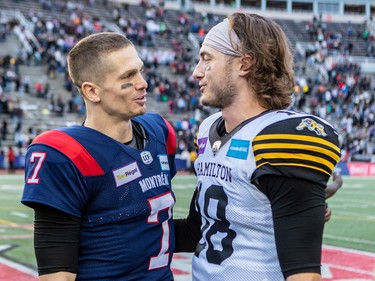 Alouettes quarterback Trevor Harris (7) greets Hamilton Tiger-Cats wide receiver Marcus Davis (18) after winning the CFL Eastern Conference semifinal 28-17 at Molson Stadium in Montreal on Sunday, Nov. 6, 2022.