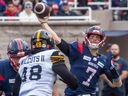 Alouettes quarterback Trevor Harris (7) passes down field against the Hamilton Tiger-Cats during first half CFL Eastern Conference semifinal action at Molson Stadium in Montreal on Sunday, Nov. 6, 2022.  