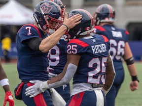 After scoring a touchdown in the first half of the CFL Eastern Conference semifinals at Percival Molson Stadium in Montreal on Sunday, Nov. 6, 2022, Alouette quarterback Trevor Harris, 7, will be replaced by his teammate's running back. Congratulations to Walter Fletcher (25).