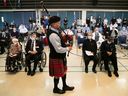 Bagpiper Sylvain Jett performs The Lament in front of veterans at a memorial service on Ste. Ann Hospital on Monday.