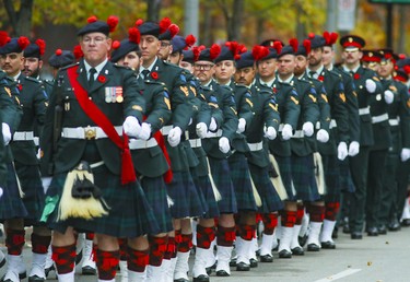 Members of the Black Watch Regiment parade up Rue de la Cathédrale following Remembrance Day ceremony in Montreal on Friday, Nov. 11, 2022.