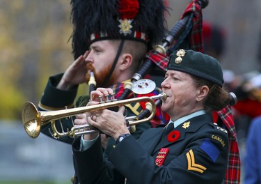 A piper from the Black Watch Regiment salutes as The Last Post is played during Remembrance Day ceremony in Montreal on Friday, Nov. 11, 2022.