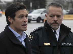 Laval Mayor Stéphane Boyer, left, and Laval police chief Pierre Brochet speak to media outside Collège Montmorency on Saturday, Nov. 12, 2022, following the Friday night school lockdown after nearby shootings that left four people injured.
